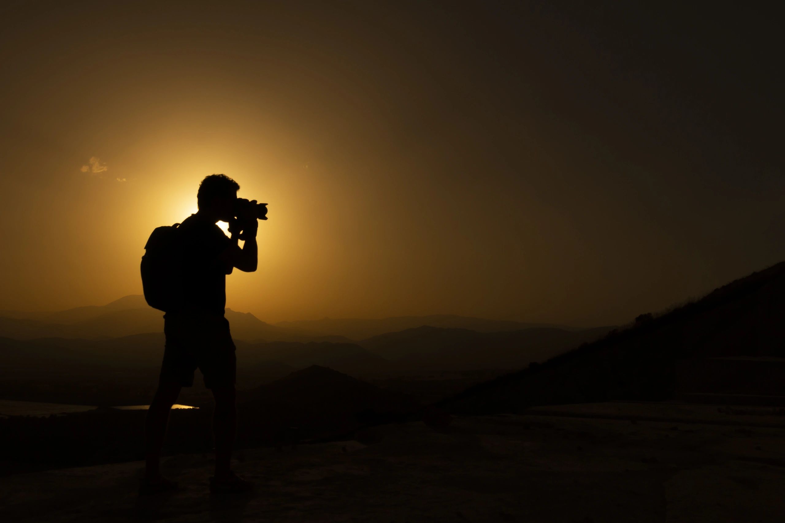 Silhouette of photographer, backlight at sunset in Andalusia